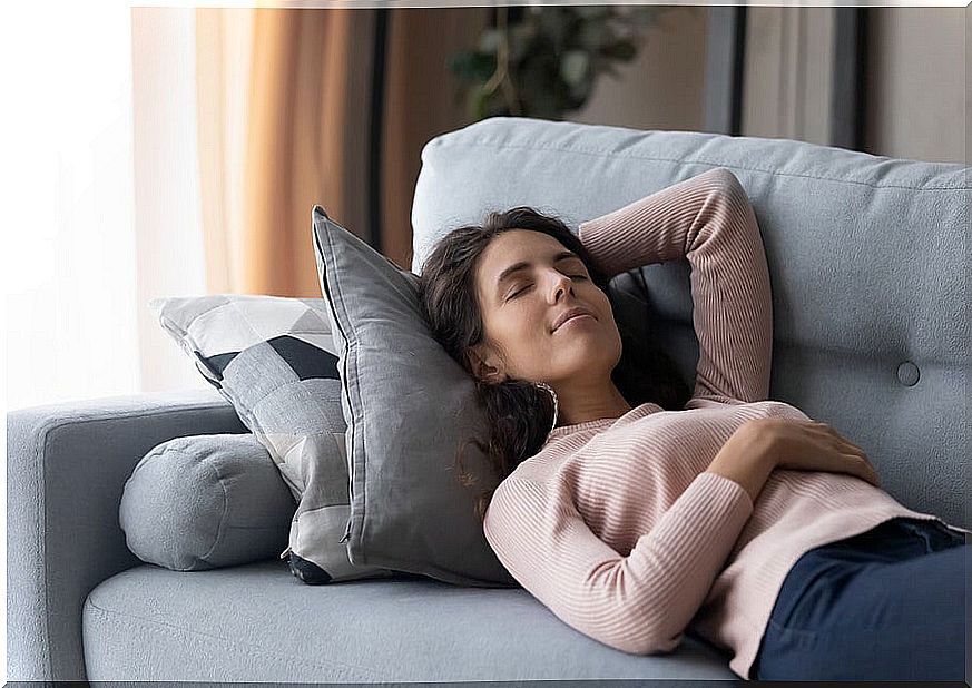 Woman taking nap on the couch.