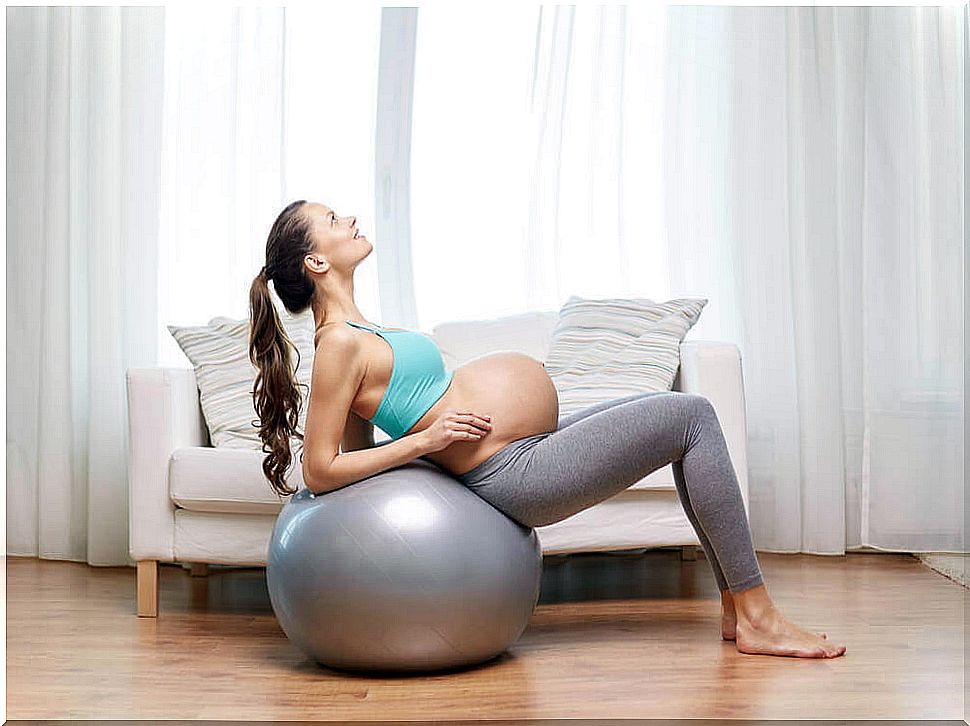 Pregnant woman exercising.