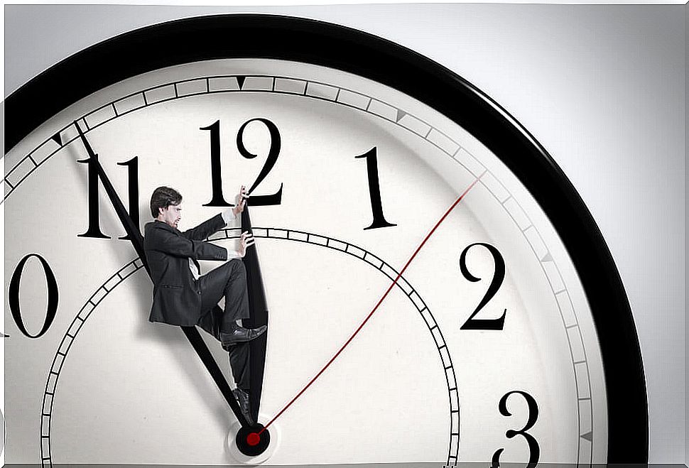 Man turning a clock forward