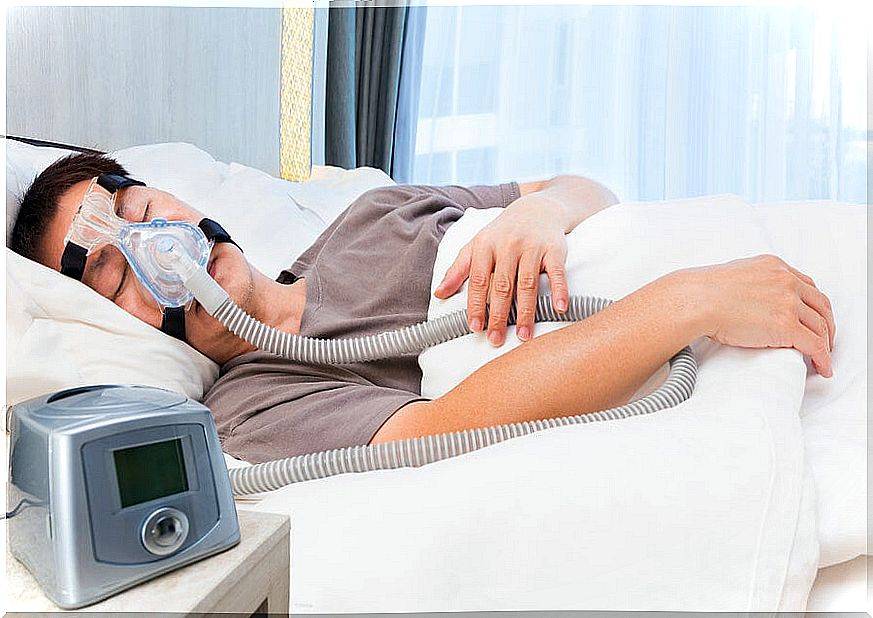 Sleep apnea patient sleeping with an air machine. 