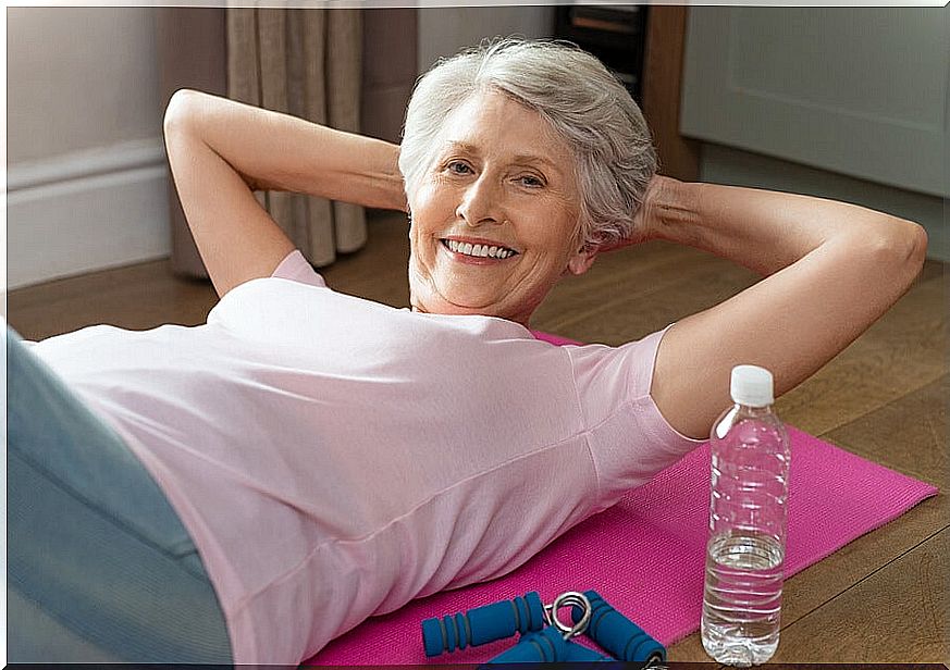 Lady exercising on her yoga mat.