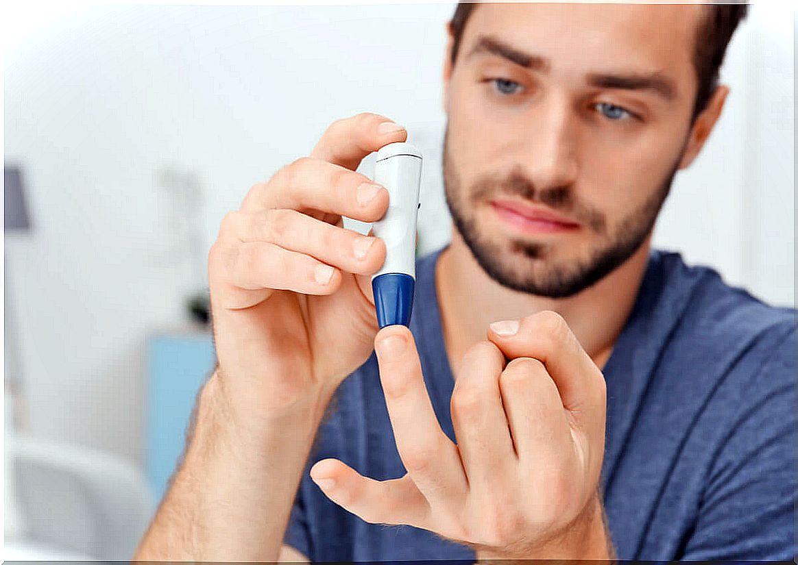 Man with diabetes measures his blood glucose.