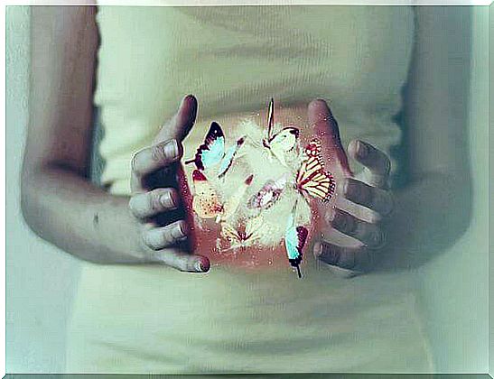 girl-with-butterflies-in-her-hand representing the magic of coincidences